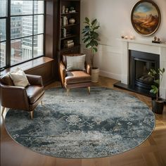 a living room filled with furniture and a fire place next to a painting on the wall