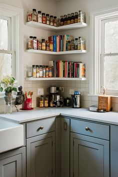 a kitchen filled with lots of counter top space next to a sink and window covered in bookshelves