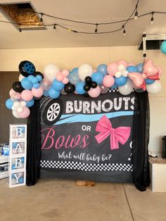 a bunch of balloons that are in front of a sign with the words burnout or boss on it