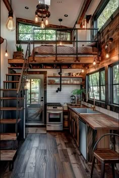 a kitchen and stairs in a tiny home