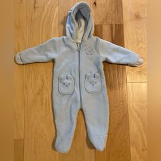 So Cute And Adorable! Pristine And No Flaws! Nwot And Never Worn. This Little Fleece Onesie By Little Wonders Is On Soft Blue Is So Snuggly And Cute! Hand And Foot Covers And A Little Hood With Ears! Front Little Pockets And Front Zipper. Very Warm And Soft! From A Smoke Free Home Ships Within One Business Day Measures: 22 Inches Total In Length From Shoulder Area To Bottom Of Foot Blue Hooded Onesie For Winter, Blue Hooded Winter Onesie, Cute Blue Winter Onesie, Light Blue Long Sleeve Onesie For Playtime, Blue Cotton Hooded Onesie, Cute Bodysuits, Footie Pajama, Blue And White Style