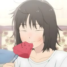 a girl eating watermelon with a fork