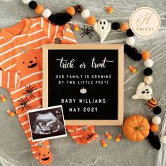 a baby's first halloween outfit and other decorations