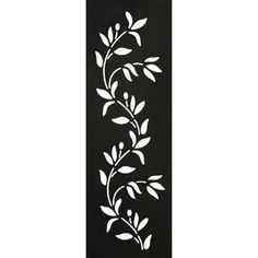 a black and white wall hanging with leaves on it