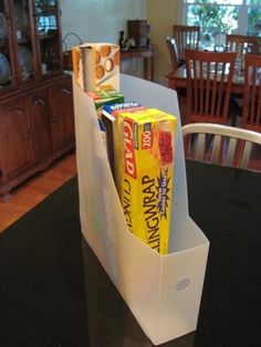 a kitchen counter top with an open bag on it and the words scrapbook paper organizer uses for the kitchen