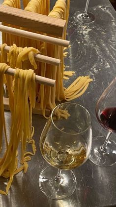 some noodles and wine are sitting on a table