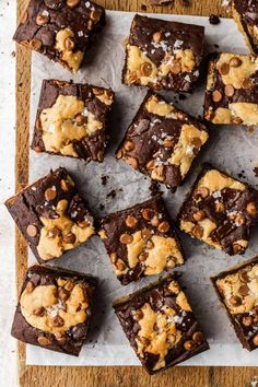 chocolate brownies with walnuts and sea salt on parchment paper, ready to be eaten