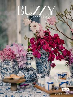 the cover of buzzzy magazine features blue and white vases with flowers in them