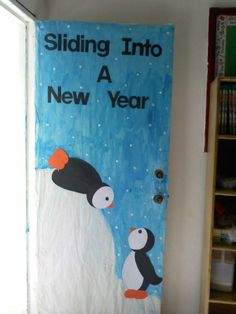 a penguin and penguinling are painted on the door to a new year's eve party