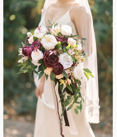 a bridal holding a bouquet of flowers