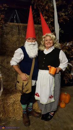 two people dressed as gnomes standing next to each other