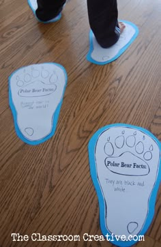 someone is standing on the floor with their foot prints in front of them that say polar bear feet