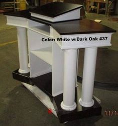 a white and black desk with columns on it