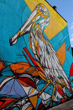 a large bird painted on the side of a building