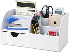 a white desk organizer with office supplies in it