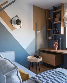 a bedroom with a desk, bed and bookcase in the corner next to it