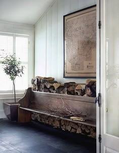 a wooden bench sitting next to a window in a room