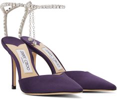 Satin heels in purple. · Pointed toe · Hook-eye ankle strap · Crystal-cut charm at heel · Logo patch at leather footbed · Covered stiletto heel · Suede sole · Heel: H4 in Supplier color: Cassis/Crystal Blue Satin Heels, Purple Accessories, Jimmy Choo Pumps, Crystal Heels, Jimmy Choo Heels, Silver Pumps, Crystal Shoes, Satin Heels, Satin Pumps