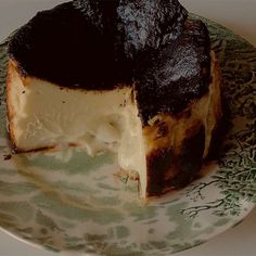 a piece of cake sitting on top of a green and white plate