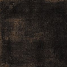 a black and brown rug with some stains on it