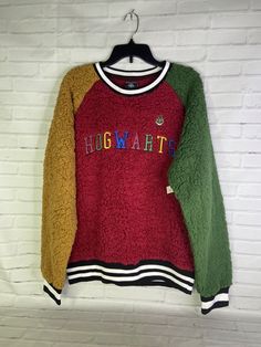 Up for grabs is a brand new with defect Harry Potter Color Block Hogwarts Collegiate Sherpa Pullover Crewneck Sweater Women's Size Medium. There is a cosmetic flaw on the back collar from improper store handling! SOLD AS IS! Relaxed fit. Colorblock design. Cotton and polyester blend. Never worn or used. Measurements Laying flat are included in photos, PLEASE compare them to your own for proper fit! Please refer to all photos. Ask any questions prior to purchasing. Thanks! Browse my store for other great listings!!! NEW listings added daily!!! PLEASE VIEW PHOTOS VERY CAREFULLY BECAUSE THEY ARE APART OF THE DESCRIPTION AND SHOWS IN GREAT DEPTH THE CORRECT CONDITION OF THE ITEM. Shipping & Handling: • We ship within 24 hours of receiving full payment on business days. Ships in a box or Poly B Harry Potter Christmas Sweater, Harry Potter Sweater, Harry Potter Colors, Sherpa Pullover, Sweater Women's, Sweater Womens, Crewneck Sweater, In A Box, View Photos