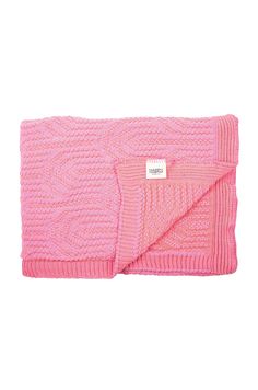 a pink knitted blanket with a white tag on the front and back of it