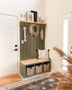 the entryway is decorated with baskets, wreaths and other things to decorate it