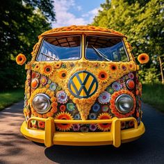 the vw bus is decorated with sunflowers and daisies on it's side