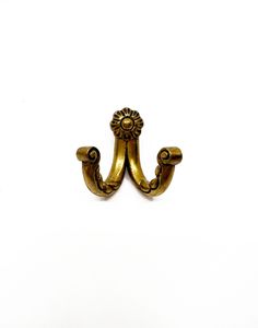 an antique brass door handle on a white background