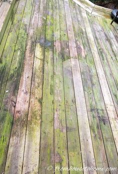 a wooden deck that has been stained green