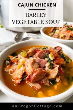 two white bowls filled with soup on top of a table