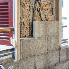 a brick wall that has been built into the side of a building