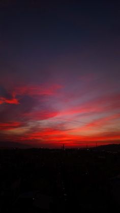 the sky is red and blue at night