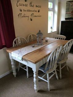 a dining room table with chairs and a lantern