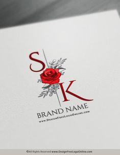 the letter k with a red rose is on top of a white sheet that says brand name