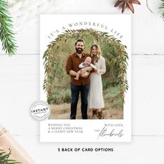 a christmas card with the words, it's a wonderful life and an image of two people holding a baby