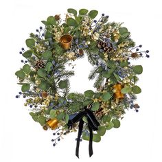 a christmas wreath with pine cones, berries and bells