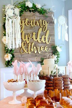 a table topped with lots of pastries and desserts