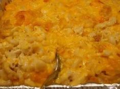 a casserole dish with macaroni and cheese on it, ready to be eaten