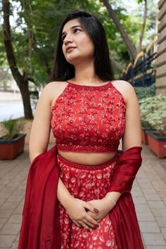 Red attached cancan lehenga with all over floral print. Paired with a padded blouse with placed hand embroidery and dupatta with mirror work hand embroidery. - Aza Fashions Red Cutdana Choli For Party, Party Red Choli With Cutdana Details, Red Sleeveless Designer Sharara, Red Sleeveless Bollywood Style Sets, Red Sleeveless Bollywood Set, Sleeveless Gown For Navratri Festival, Red Sleeveless Lehenga For Party, Sleeveless Red Lehenga For Party, Red Sleeveless Party Lehenga