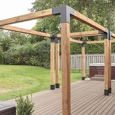 a wooden deck with an outdoor hot tub