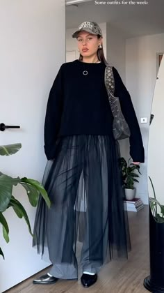 Sheer Pleated Skirt Outfit, Skirt Layered Over Pants, Skirt Over Pants Street Style, Tulle Skirt Street Style, Mesh Dress Outfit Street Style, Mesh Skirt Outfit Ideas, Skirt Layering Outfit, Tulle Skirt Outfit Winter, Tulle Skirt Outfit Casual Street Style