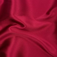 Slip into something amazing with this Nicolette Wine Polyester Mikado. Both sides feature an elegant wine-red color, with the face presenting an alluring shine and slick but slightly textured hand. Pliable and somewhat voluminous in drape, craft structured evening gowns, blazers, trousers, or jumpsuits. While opaque, a lining may be added for additional structure and a polished finish when desired. Mood Designer Fabrics, Wine Red Color, Wine Red, Evening Gowns, Wine, Color