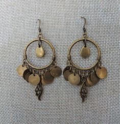 "Antique brass dangle hoops are accented with matching coin beads in these boho style earrings. The overall length of the earrings is 2 1/4\" from ear wire link. The diameter of the hoop is 1 \". all of my jewelry items come boxed, and ribbon tied and tagged for easy gifting." Antique Brass Earrings, Brass Jewellery, Boho Style Earrings, Gem Earrings, Earrings Antique, Coin Earrings, Costume Earrings, Dope Jewelry, Nail Jewelry