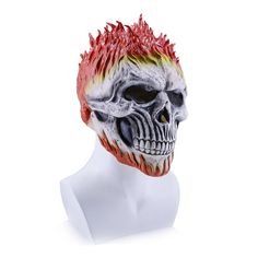 a white mannequin head with red and yellow hair on it's face