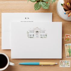 a desk with some stamps and a cup of coffee