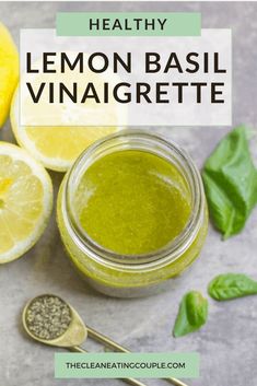 lemon basil vinaigrete in a glass jar next to sliced lemons