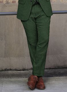 Flaunt your elegant dressing sense with great zeal by simply donning our Harris Tweed Wide Herringbone Royal Green Pants. Crafted from 100% wool, the pants add a touch of class to your wardrobe and you will definitely be the recipient of compliments all day long, thanks to the rich fresh hue and the herringbone weave on the outfit.    Look Includes  Harris Tweed Wide Herringbone Royal Green Fabric  Cross Pocket  Flat Front  Two Welted Back Pockets on Trousers   You can change the look during cus Elegant Fitted Tweed Bottoms, Tailored Tweed Pants For Fall, Elegant Tweed Pants For Business, Elegant Tweed Bottoms For Business, Tailored Tweed Fall Bottoms, Tailored Tweed Bottoms For Fall, Elegant Tweed Pants For Tailoring, Formal Tweed Pants With Herringbone Pattern, Full Length Wool Suits For Tailoring