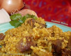 a blue plate topped with rice and meat