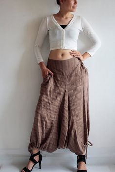 Beautiful double layer fabric made of cotton/linen blend.  High quality and stunning beauty. The fabric is unbleached and undyed, you can see the bark fibres in it! Subtle stripe patternDrop-crotch style pants, baggy pants, tribal pants with a twist.3 ways to wear. with drawstring on the hem. You can wear it with drawstring loose. Like a wide leg pants. Even look like A shape sweet skirt.You can also draw the string and get a balloon shape pants.Or...you can put the hem above your knee and get a Hippie Style Cotton Pants For Fall, Brown Cotton Harem Pants For Fall, Fitted Cotton Harem Pants For Festivals, Cotton Harem Pants For Fall, Fall Cotton Harem Pants, Cotton Harem Pants For Fall Festival, Bohemian Brown Cotton Pants, Loosely Fitted Harem Bottoms For Fall, Relaxed Fit Harem Bottoms For Fall